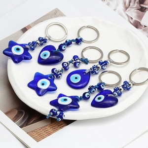 Evil Eye keychain set featuring star and heart glass charms in blue and silver finish