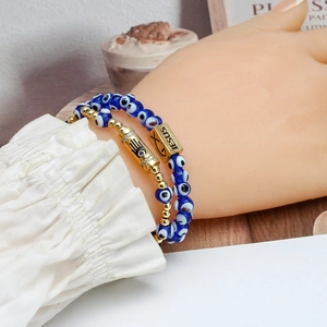 Set of Evil Eye and Jesus fish beaded bracelets with a golden Hamsa Hand charm