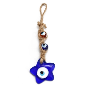 Detailed view of handmade Evil Eye star charm with jute rope for wall hanging or car decor