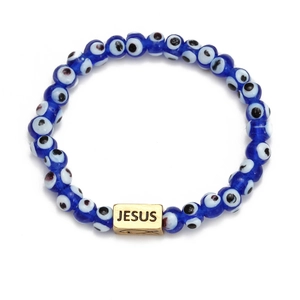 Detail of blue Evil Eye beaded bracelet featuring a gold Jesus engraving metal charm