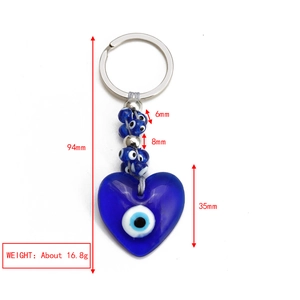 Macro detail of Nazar blue glass heart keychain with silver metal ring and bead dimensions