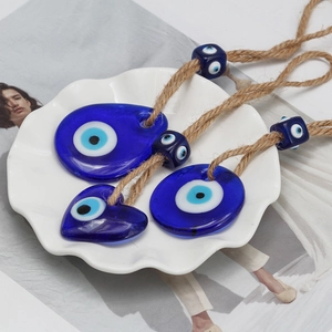 Mediterranean Evil Eye glass pendants in heart, drop, and round shapes with rustic jute ropes
