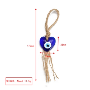 Blue heart evil eye charm with jute rope tassel and size dimensions 170mm by 35mm
