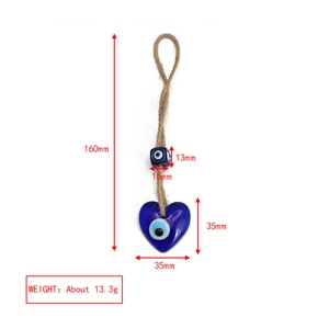 Detailed view of blue heart-shaped evil eye pendant with 160mm rope and size markers
