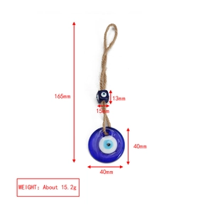 Macro detail of Evil Eye pendant with blue glass ring and rustic jute rope hanging