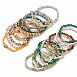Bohemian evil eye beaded bracelet set with colorful natural stones and gold metal accents
