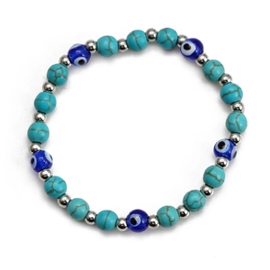 Detailed view of beaded bracelet featuring turquoise stones and blue evil eye charms