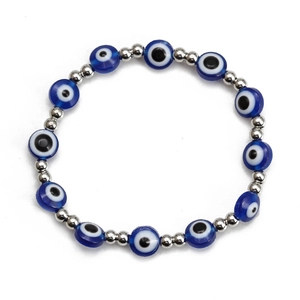 Detailed close-up of Blue Evil Eye beaded bracelet with silver copper spacers on white back