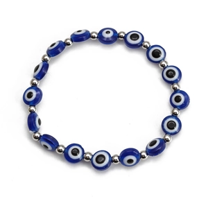Detail of blue evil eye beads and polished silver spacer beads on a round bracelet