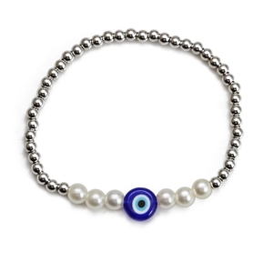Detail of silver beaded elastic bracelet with blue evil eye and pearl accents