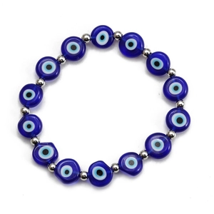 Detailed close-up of blue Evil Eye flat beads with silver metal spacer beads on a bracelet