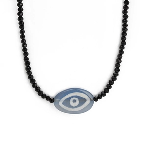 Elegant beaded Evil Eye necklace featuring faceted black beads and a blue center charm