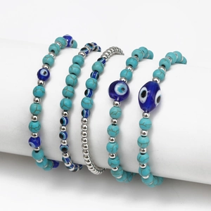 5-piece set of blue evil eye beaded bracelets with turquoise and silver accents