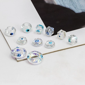 Polished glass Evil Eye beads in various geometric shapes for jewelry making and DIY projects