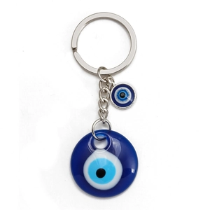 Blue Evil Eye keychain with round glass pendant and silver metal ring on white background