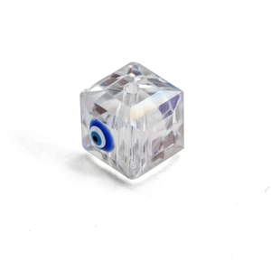 Macro detail of faceted cubic crystal bead with blue evil eye pattern for DIY jewelry