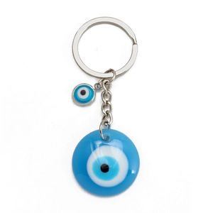 Detailed view of evil eye keychain with blue resin charms and silver alloy rings