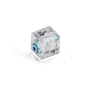 Macro detail of cube crystal evil eye bead with blue pupil for DIY jewelry making