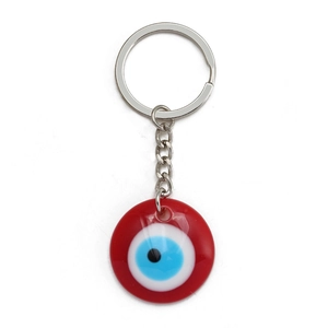 Turkish Evil Eye keychain with red resin pendant and silver metal ring on white background