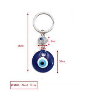 Detail view of Evil Eye keychain with blue resin charms and silver metal ring, 85mm length
