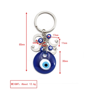 Detailed size specifications of the blue evil eye keychain with moon and star charms