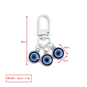 Detail showing dimensions of blue evil eye keychain charms with 50mm total length