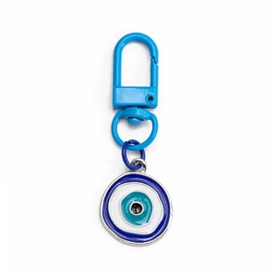 Close-up of blue lobster clasp and evil eye enamel pendant with classic circular patterns