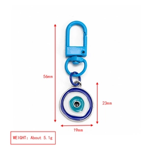 Macro shot of evil eye keychain with blue enamel pendant including 56mm length details