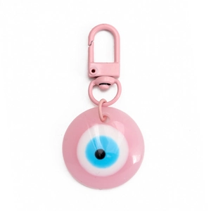 Detail of pink Evil Eye round keychain with a matching D-ring clasp on white background
