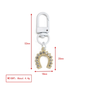 Detail showing dimensions of the 52mm horseshoe evil eye keychain with white rhinestones