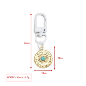 Detailed view of evil eye keychain showing dimensions 56mm length and gold-plated details