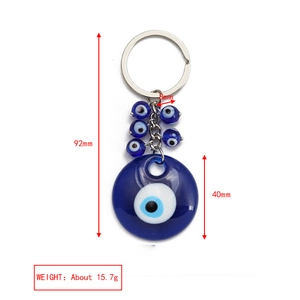 Detailed view of evil eye keychain with measurements showing blue glass beads and metal ring