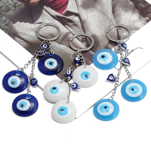 Handmade Evil Eye keychains with colorful glass beads and silver heart charms in three colors