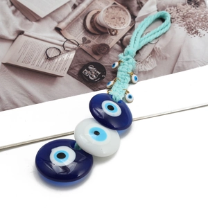 Blue Evil Eye hanging ornament with woven rope and multiple resin charms for car decor