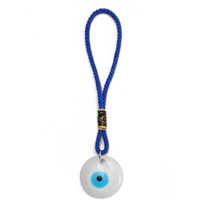 Macro shot of blue braided rope Evil Eye pendant with white round charm and gold rings