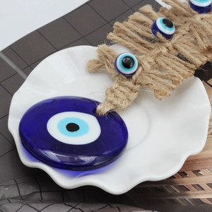 Blue glass Evil Eye hanging ornament with woven jute rope for wall and car decor