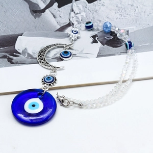 Detail of Hamsa Hand and Evil Eye car pendant with moon charm and crystal beads