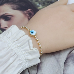 Bracelet élégant en perles avec œil protecteur plaqué or et cristaux pour femme