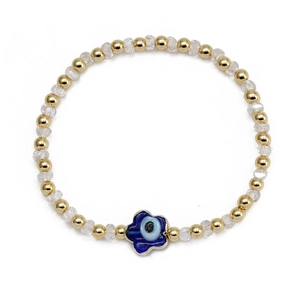 Bracelet élégant en perles dorées avec cristal clair et breloque fleur de l'œil bleu