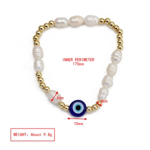 Detailed view of bohemian bracelet featuring baroque pearls and evil eye charm with dimensions