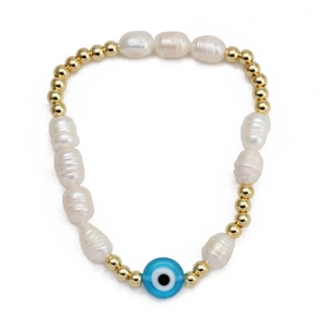 Close-up of pearl evil eye bracelet with white freshwater pearls and golden metal beads