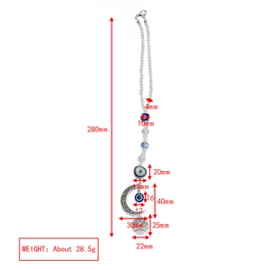Detailed view of evil eye moon keychain with product dimensions and clear crystal ball