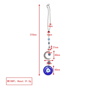 Detailed view of evil eye glass charm with Hamsa hand and crescent moon dimensions