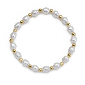Detail view of baroque pearls and polished gold beads on the elastic beaded bracelet