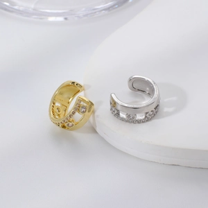 Minimalist gold and silver C-shaped ear cuffs with round cubic zirconia in hollow design