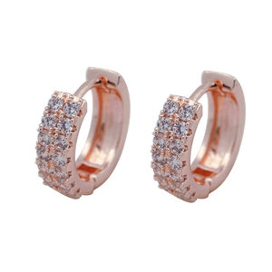 Elegant rose gold huggie hoop earrings with double-row cubic zirconia inlay on white background