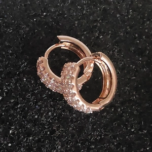 Elegant rose gold huggie hoop earrings with multi-row pavé cubic zirconia inlay
