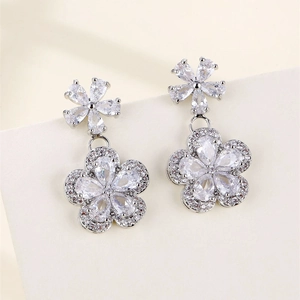 Silver plum blossom dangle earrings with zircon stones and pear-cut crystal petals