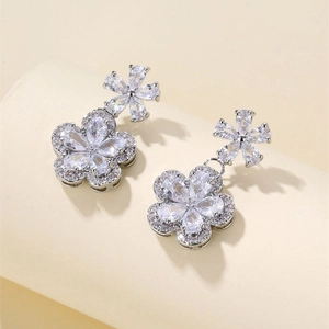 Elegant silver flower drop earrings with sparkling pear-cut cubic zirconia crystals