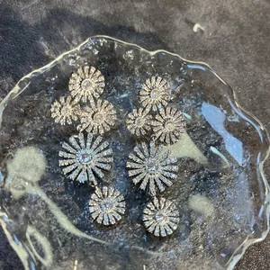 Elegant silver sunflower drop earrings with cubic zirconia inlay on water ripple glass